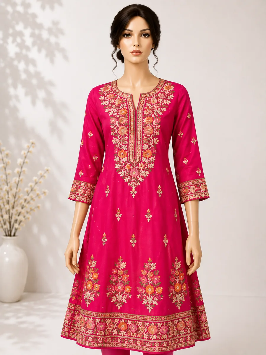 A pink cotton kurti with floral block print and an embroidered neckline, on a studio mannequin
